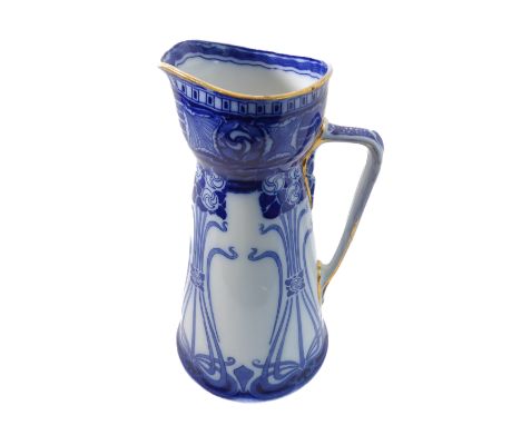 A large late 19th / early 20th century Royal Doulton pitcher decorated in underglaze blue in high Art Nouveau style and in th