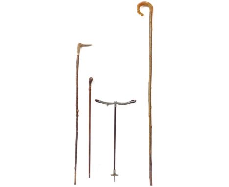 Three sticks and a shooting stick:a 162cm shepherd's crook, goat-horn handle with thistle motifa 128cm walking stick with ant