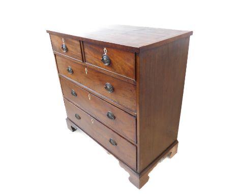 A George III mahogany chest of small proportions; the crossbanded top above two half-width and three full-width graduated dra