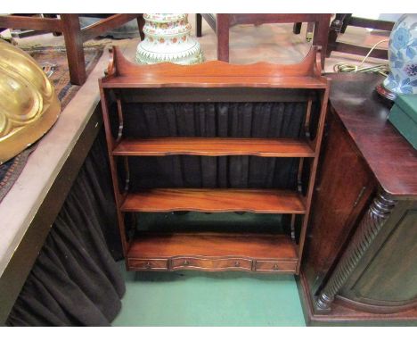 A Bevan Funnell Georgian style mahogany serpentine front wall hanging four tier shelf with three lower drawers, 92cm high x 6
