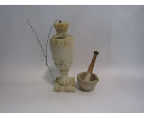 An alabaster table lamp base and pestle and mortar