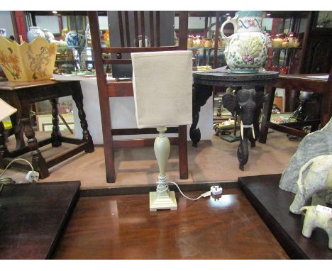 A cream table lamp and shade