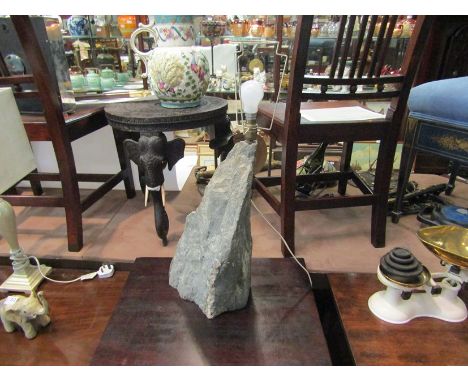A large section of granite, converted to a table lamp