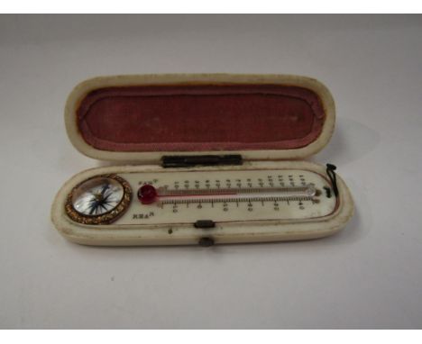 A 19th Century ivory cased thermometer and compass set