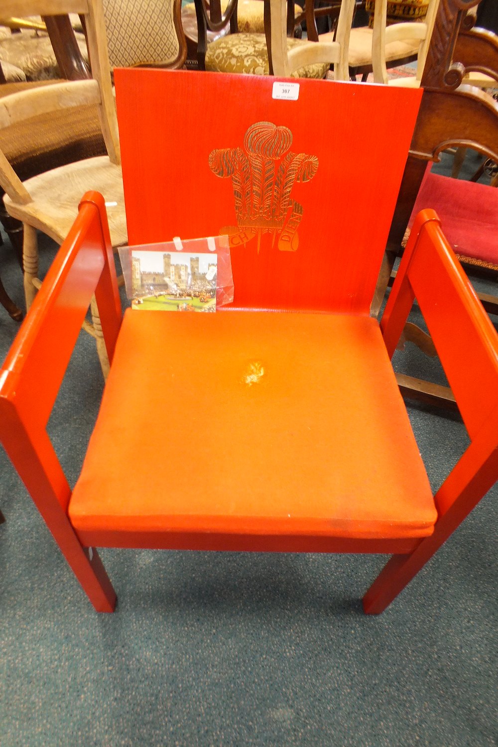 A red painted HRH Prince Charles Prince of Wales Investiture chair from