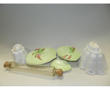 Two 19th century white glazed moulds, a glass rolling pin, two salt glazed earthen ware containers, four butter pats, a salt 