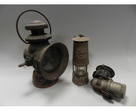 A Lamp and Lighting Company Ltd, Eccles Manchester, the protector miners' lamp along with a further miners' lamps, a car lamp