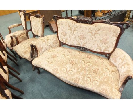 An Edwardian mahogany salon suite comprising of two open armchairs, four single side chairs and a two seater canape in the Ch