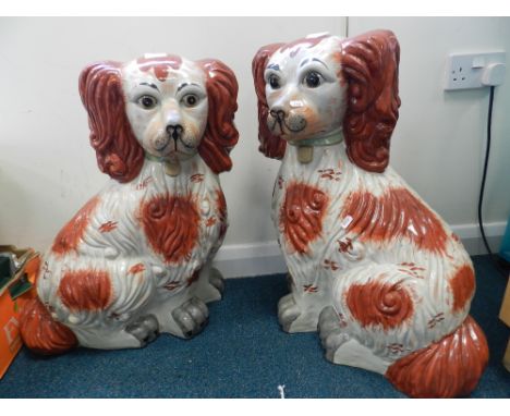 A pair of modern russet patch oversized floor standing spaniels 