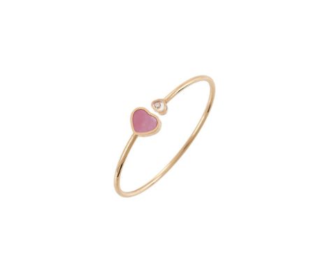 Y&nbspCHOPARD, HAPPY HEART, AN 18 CARAT GOLD, DIAMOND AND MOTHER OF PEARL BANGLE  The polished gold coloured bangle with a gl