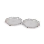 A PAIR OF GEORGE II SILVER SHAPED CIRCULAR SALVERS