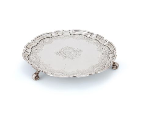 A GEORGE II SILVER SHAPED CIRCULAR SALVER  EDWARD FELINE, LONDON 1736 With a raised moulded border, engraved with a shell and