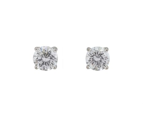 A PAIR OF DIAMOND STUD EARRINGS  The brilliant cut diamonds in four claw white settings, approximately 1.10 carats total, unm