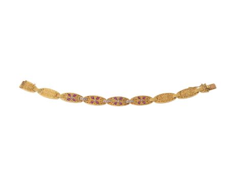 AN EARLY 20TH CENTURY RUBY AND DIAMOND BRACELET  The bracelet composed of oval panels, the front four set with pear cut ruby 