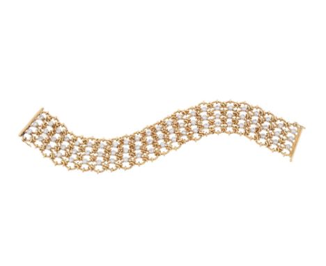 A DIAMOND BROAD BRACELET  The articulated polished and rope twist gold coloured wire lattice links with collet set brilliant 