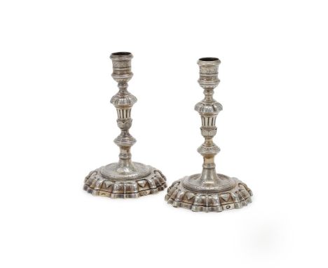 A PAIR OF IRISH SILVER GILT CANDLESTICKS DUBLIN, NO APPARENT MAKER'S MARK OR DATE LETTER, 18TH CENTURY With spool capitals, k