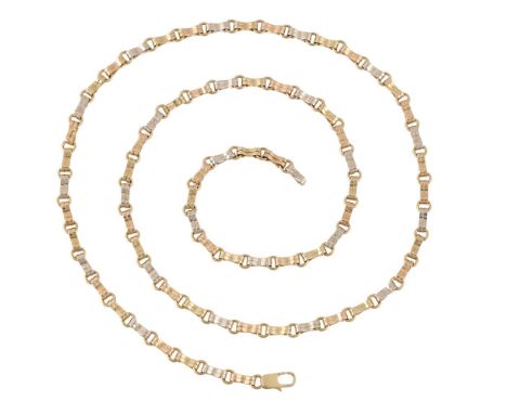AN ITALIAN THREE COLOUR FANCY LINK CHAIN NECKLACE  The hooped links to a pair of polished shaped three colour bars, the clasp