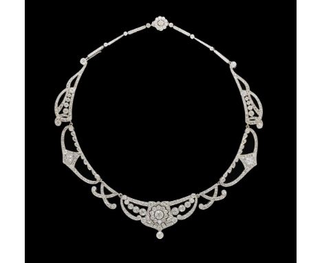 A CONVERTIBLE DIAMOND TIARA/NECKLACE/BROOCH  FIRST HALF OF THE 20TH CENTURY AND LATER  Composed of tapering scrolled articula