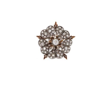 A LATE VICTORIAN DIAMOND DOG ROSE BROOCH  CIRCA 1880  The flower head with five pavé set old cut and rose cut diamond gold ba
