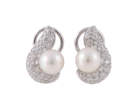 A PAIR OF DIAMOND AND CULTURED PEARL EAR CLIPS   The scrolled panels pavé set with brilliant cut diamonds, approximately 1.50