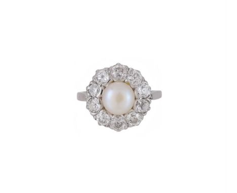 A DIAMOND AND CULTURED PEARL CLUSTER RING The bouton cultured pearl within a surround of old mine cut diamonds, approximately