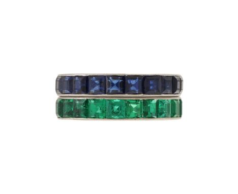 A MID 20TH CENTURY EMERALD ETERNITY RING AND A SAPPHIRE ETERNITY RING  The first ring channel set with step cut emeralds, unm