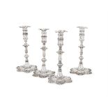 A SET OF FOUR GEORGE III IRISH SILVER CANDLESTICKS