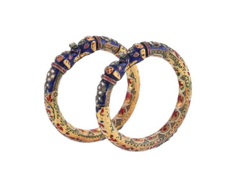 A PAIR OF 19TH CENTURY INDIAN DIAMOND, RUBY AND JAIPUR ENAMELLED ELEPHANT HEAD KADA BANGLES  The bangles with swivelling oppo