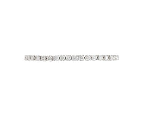 A DIAMOND LINE BRACELET  The articulated bracelet with brilliant cut diamonds in four claw settings, approximately 8 carats t