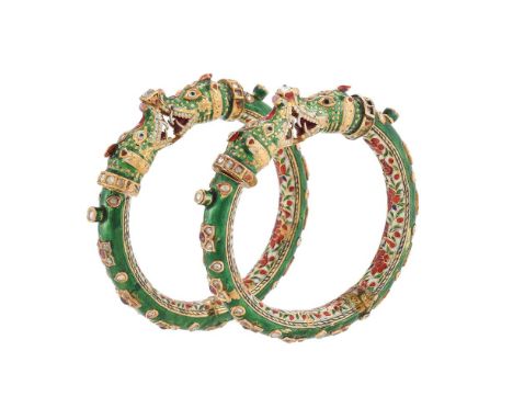 A PAIR OF 19TH CENTURY INDIAN GOLD, GEM AND JAIPUR ENAMELLED MAKARA HEAD KADA BANGLES   The bangles with swivelling green ena