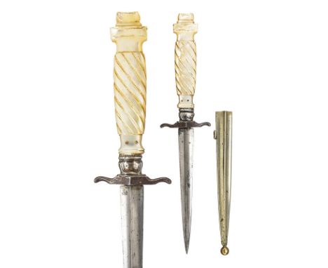 A small dagger dating: last quarter of the 18th Century provenance: France Strong blade with four edges; iron quillon, carved