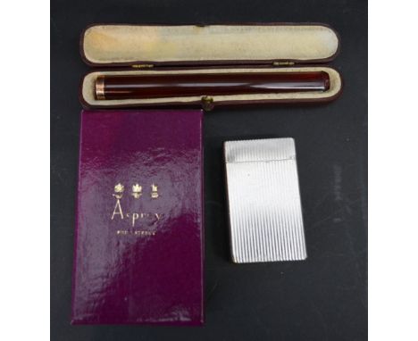 A Long Amber Cheroot with 9ct. Gold Mount Within Fitted Case, together with a Dupont lighter within an Asprey box