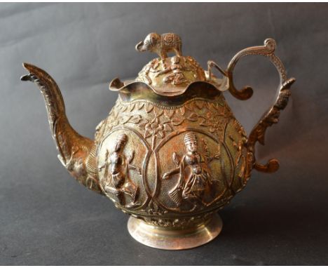 An Indian White Metal Teapot, decorated in relief with figures and with shaped handle, 10 ozs.