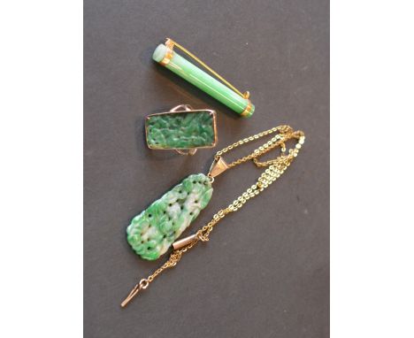 A Chinese Jade Set Ring set in yellow metal together with a similar pendant and a brooch