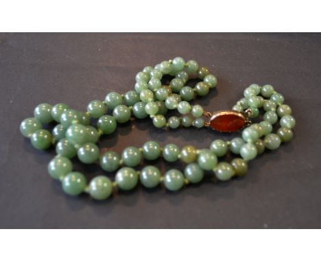 A Green Jade Bead Necklace with Yellow Metal Clasp