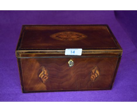 A Victorian tea caddy having mahogany and inlaid case with lidded twin compartment inner