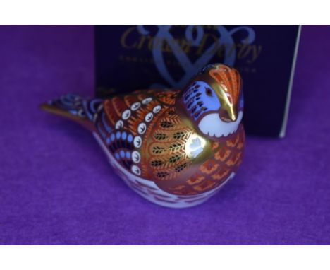 A ceramic Royal Crown Derby paper weight or figure of a Linnet having gold stopper and box