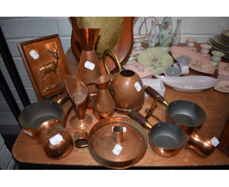 A selection of copper wares including chamber stick and watering can etc