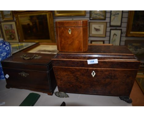 A walnut burr casket style tea caddy having fitted interior and two similar Victorian examples