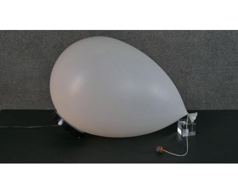Yves Christin for Bilumen, Italy, 1973, a white plastic balloon lamp with moulded maker's marks to the black stand. L.55cm 