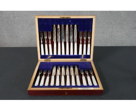 A canteen of late 19th century silver plated and mother of pearl handled fruit knives and forks for six people. Makers plaque