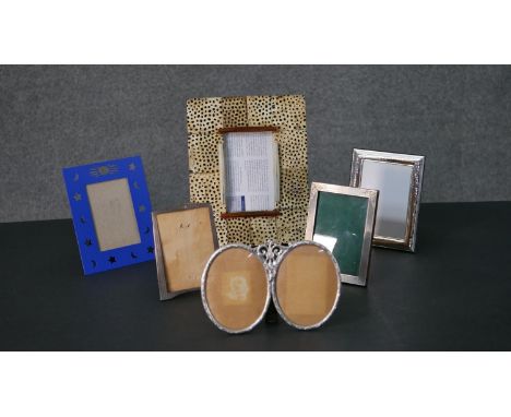 A collection of easel backed picture frames, including three silver picture frames. H.26 W.21cm (largest) 