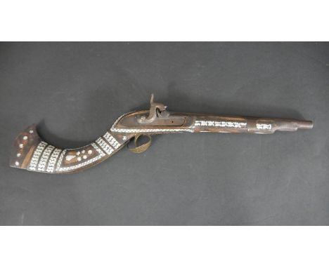 A 19th century Indian percussion musket, the butt and stock decorated with mother of pearl and engraved detailing to the meta