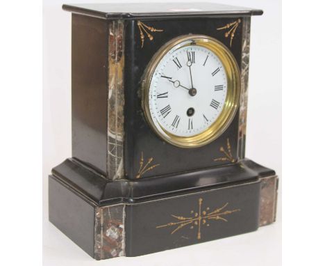 A late Victorian black slate and grey marble cased mantel clock, having a circular enamelled dial with Roman numerals and 30-