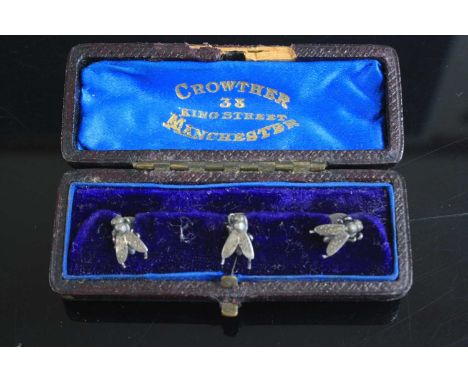 A set of three early 20th century white metal collar studs, each in the form of an insect, in Crowther of King St. Manchester