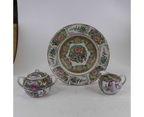 A Chinese Canton plate, enamel decorated with birds amongst flowers, together with similar milk jug and sugar bowl