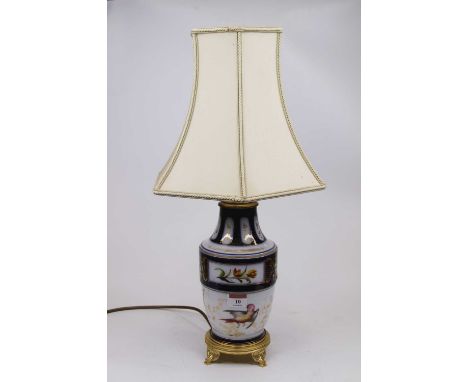 A 20th century ceramic table lamp decorated with birds and flowers on gilt metal base with silk shade, height 52cm