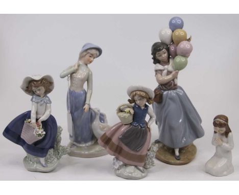 A Lladro porcelain figure of a girl holding a bunch of balloons, h.25cm; together with another two Lladro figures of girls ho