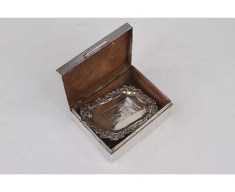 A George V silver table cigarette box, of typical rectangular form, having all-over engine turned decoration and cedar lined 