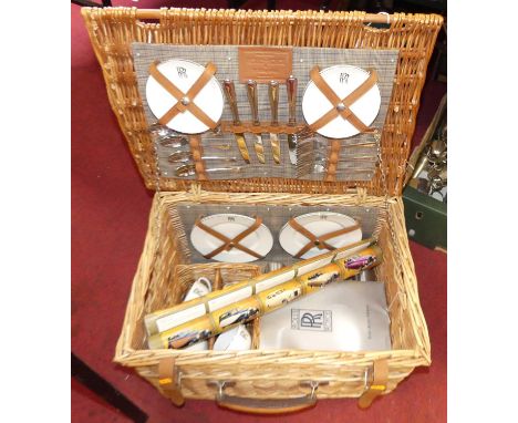 A Rolls Royce four-place picnic set by W Gadsby &amp; Son, to include plates, cups and saucers, and cutlery, in a wicker bask